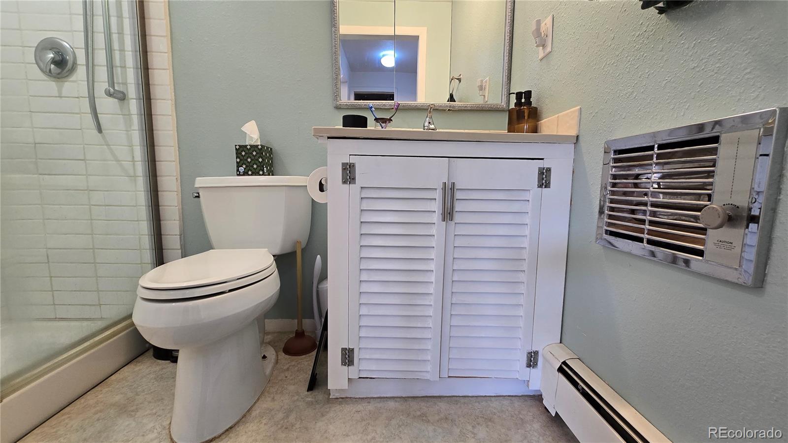 411 Gruenberg Road Fort Garland, CO 81133 - Photo 25 of 41 a bathroom with a sink a toilet and shower