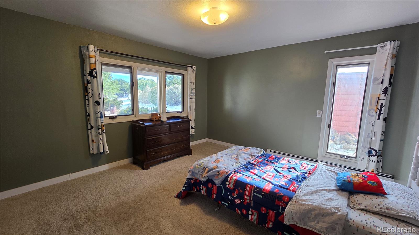 411 Gruenberg Road Fort Garland, CO 81133 - Photo 27 of 41 a bedroom with a bed and a window