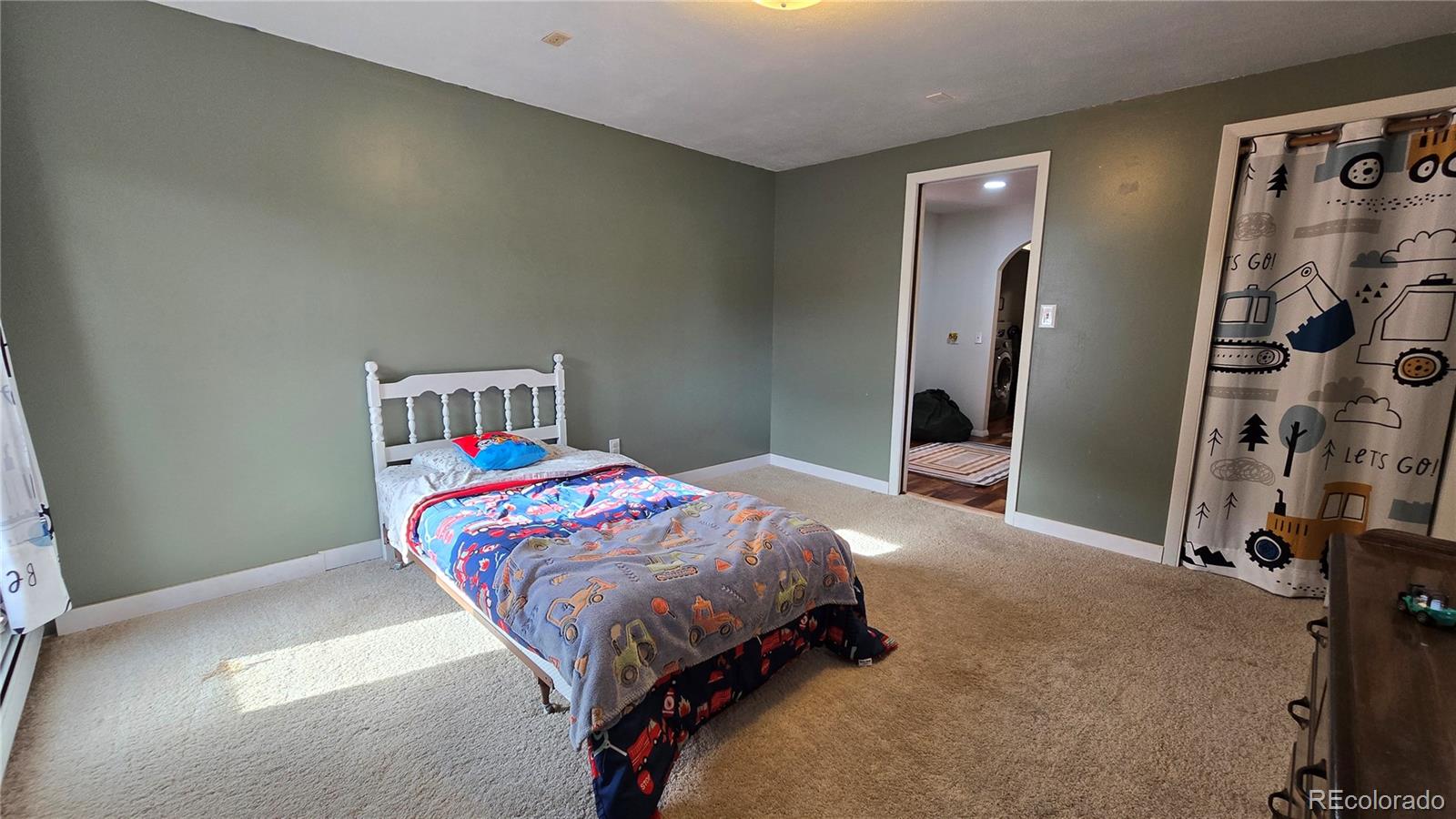 411 Gruenberg Road Fort Garland, CO 81133 - Photo 28 of 41 a bedroom with a bed and a window