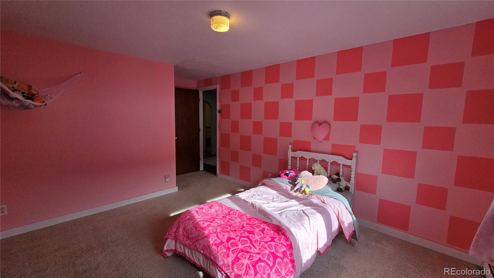 411 Gruenberg Road Fort Garland, CO 81133 - Photo 29 of 41 a bedroom with a bed and a mirror