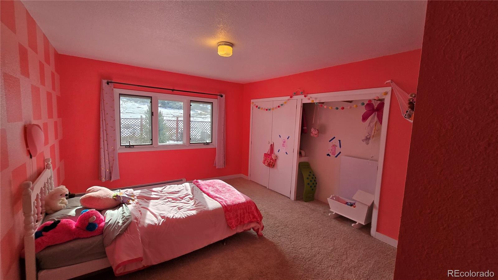 411 Gruenberg Road Fort Garland, CO 81133 - Photo 30 of 41 a bedroom with a bed and a window