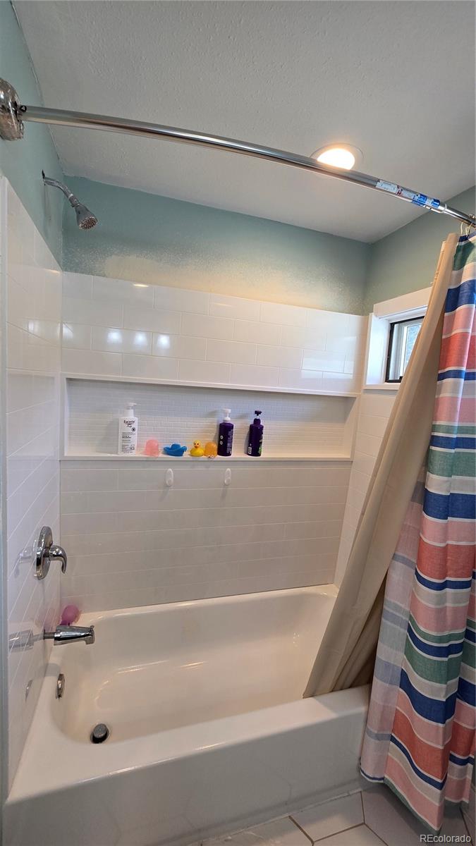 411 Gruenberg Road Fort Garland, CO 81133 - Photo 34 of 41 a bathroom with a bathtub and a shower