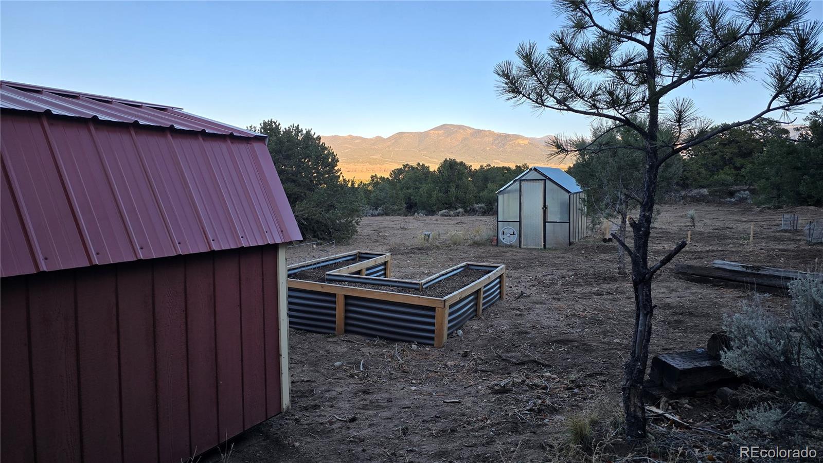 411 Gruenberg Road Fort Garland, CO 81133 - Photo 38 of 41 a backyard of a house with wooden fence