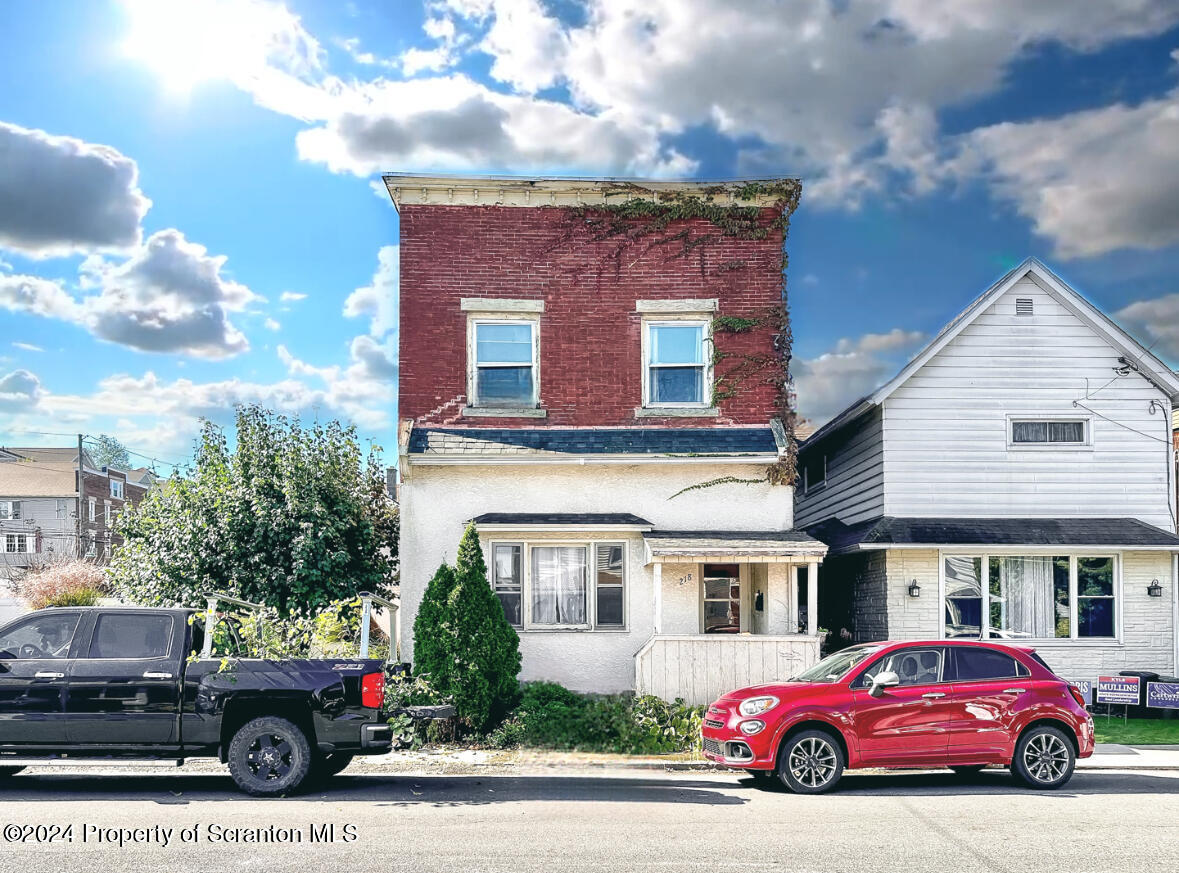 a car parked in front of a house