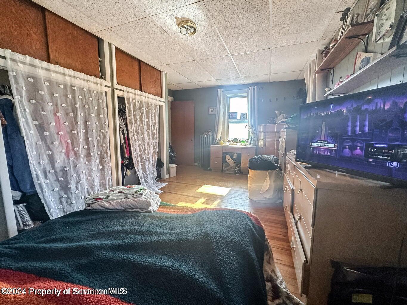 218 Hand Street, Unit 2 Jessup, PA 18434 - Photo 14 of 15 a bed room with a bed and a couch