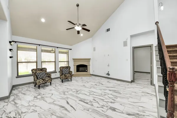 a view of a livingroom with furniture and a fireplace