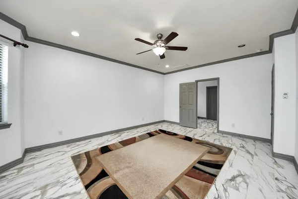 a room with wooden floor and window