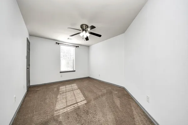 a view of empty room with windows