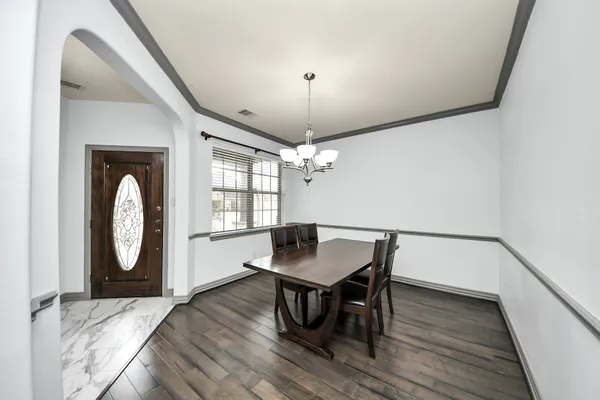 a workspace with furniture window and wooden floor