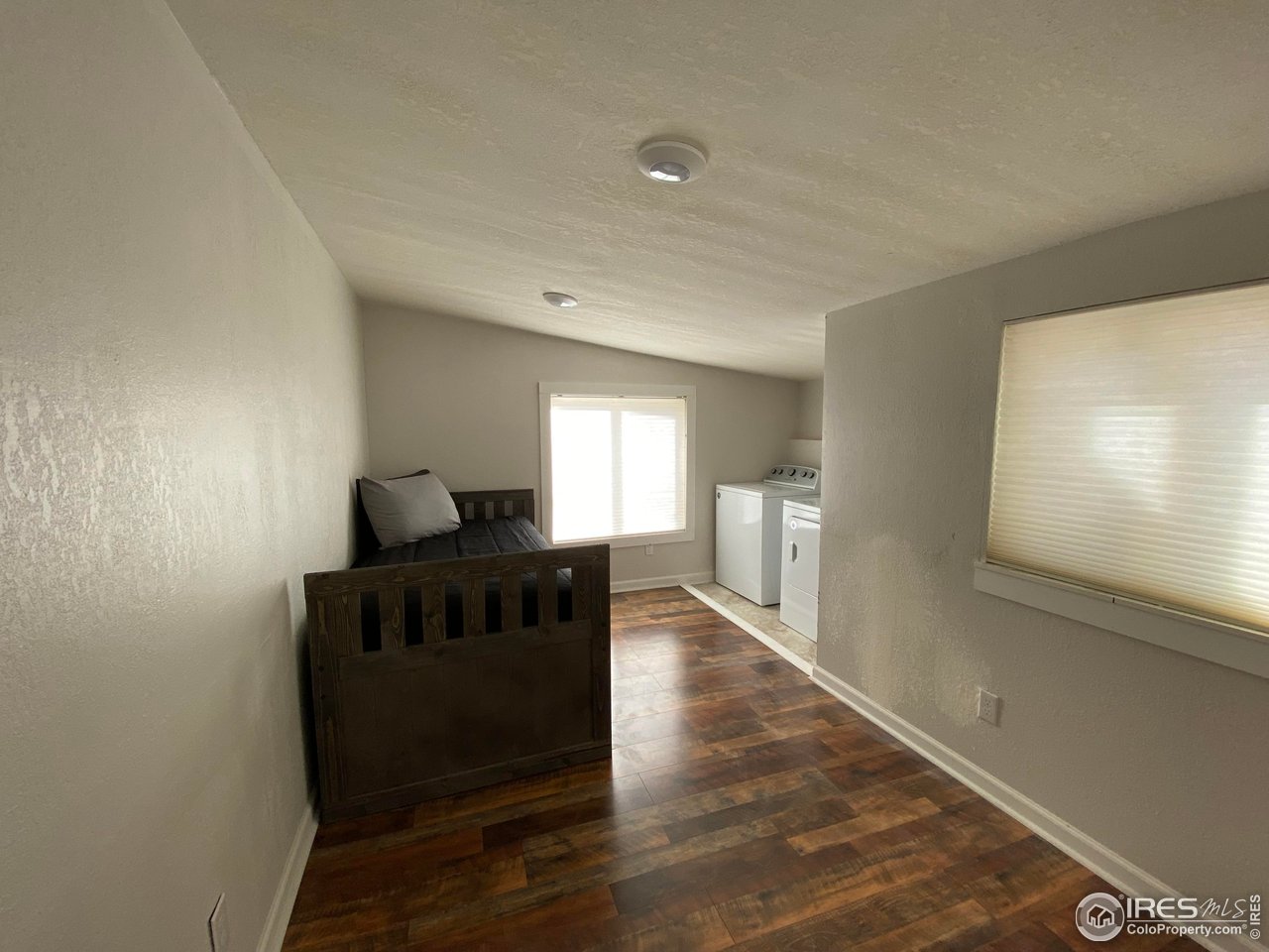 2127 Us Highway Drake, CO 80515 - Photo 13 of 34 a living room with furniture and a wooden floor
