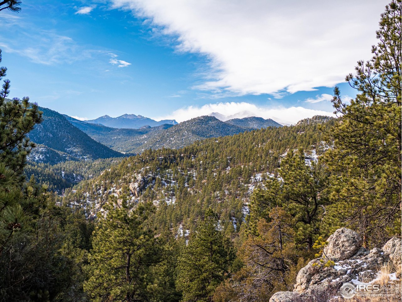 2127 Us Highway Drake, CO 80515 - Photo 31 of 34 a view of a mountain range in a cloudy sky