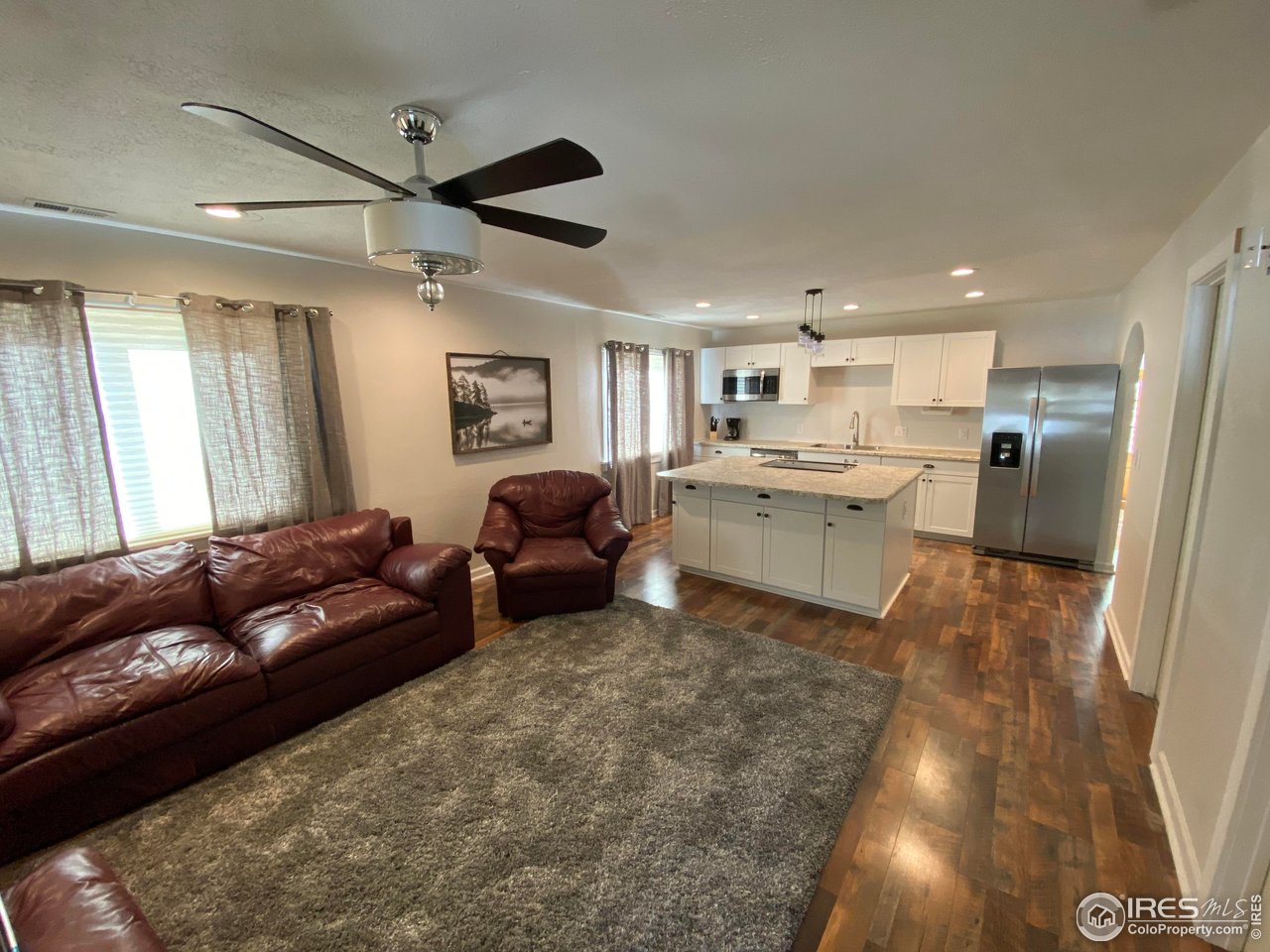 2127 Us Highway Drake, CO 80515 - Photo 8 of 34 a living room with furniture and a kitchen
