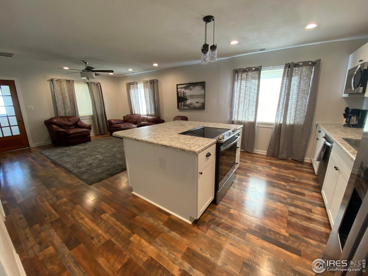 2127 Us Highway Drake, CO 80515 - Photo 9 of 34 a large kitchen with stainless steel appliances granite countertop a sink stove and refrigerator