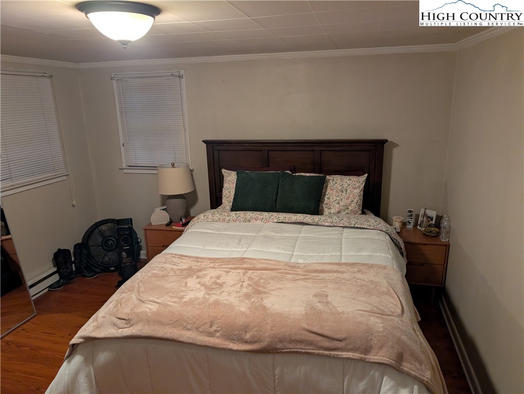 1630 Highway 194 Boone, NC 28607 - Photo 12 of 12 a bedroom with a bed and window