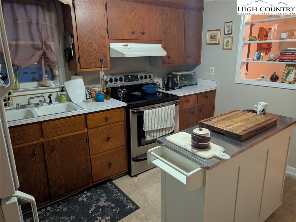 1630 Highway 194 Boone, NC 28607 - Photo 6 of 12 a kitchen with a stove and a sink