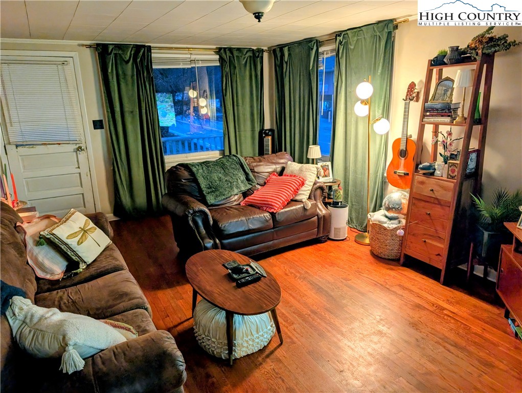 1630 Highway 194 Boone, NC 28607 - Photo 9 of 12 a bedroom with furniture and a window