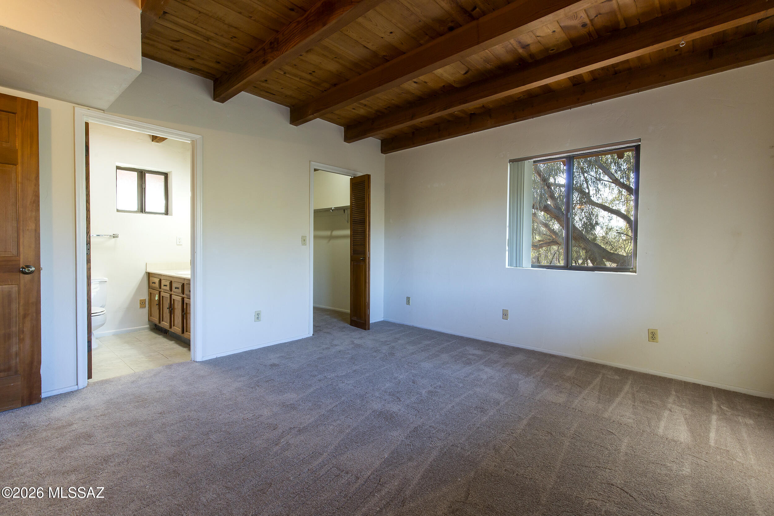 4130 East River Road Tucson, AZ 85718 - Photo 37 of 46 a view of an empty room with a window