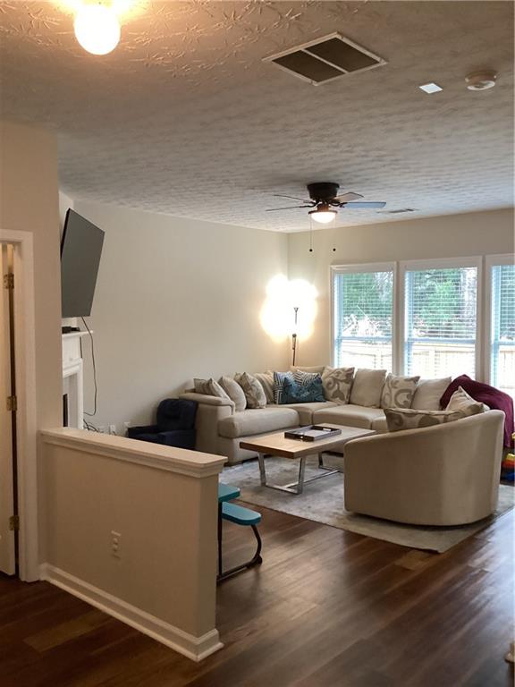 2546 Tullamore Circle Snellville, GA 30039 - Photo 11 of 35 a living room with furniture and a large window