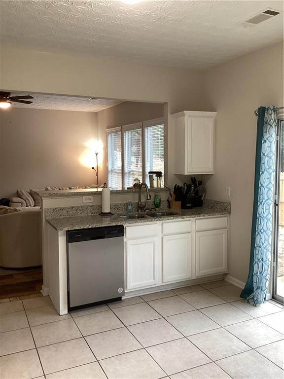 2546 Tullamore Circle Snellville, GA 30039 - Photo 13 of 35 a kitchen with granite countertop white cabinets and white appliances