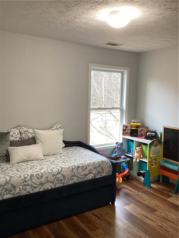 2546 Tullamore Circle Snellville, GA 30039 - Photo 23 of 35 a bedroom with a bed and a window