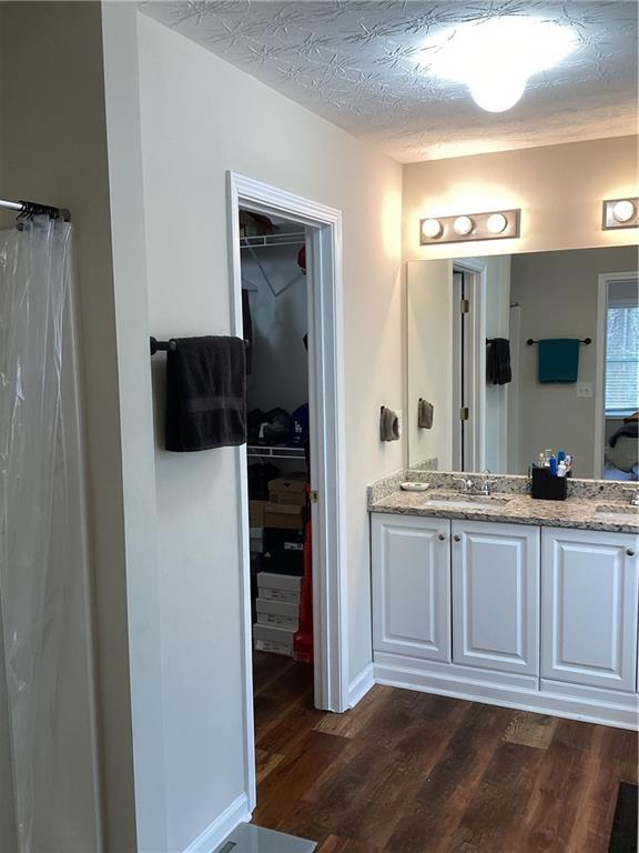 2546 Tullamore Circle Snellville, GA 30039 - Photo 29 of 35 a spacious bathroom with a sink and a mirror