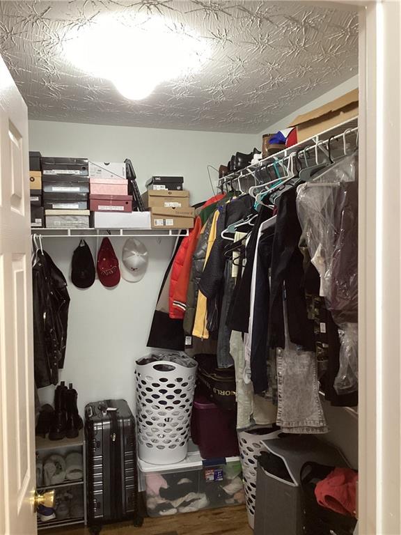 2546 Tullamore Circle Snellville, GA 30039 - Photo 30 of 35 a view of walk in closet with clothes and shoes