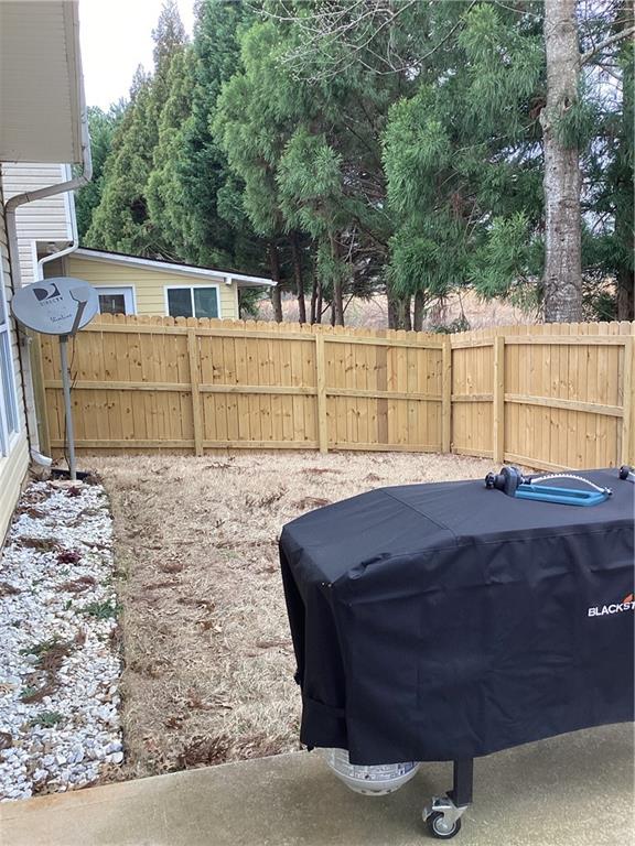 2546 Tullamore Circle Snellville, GA 30039 - Photo 32 of 35 a view of a back yard of the house