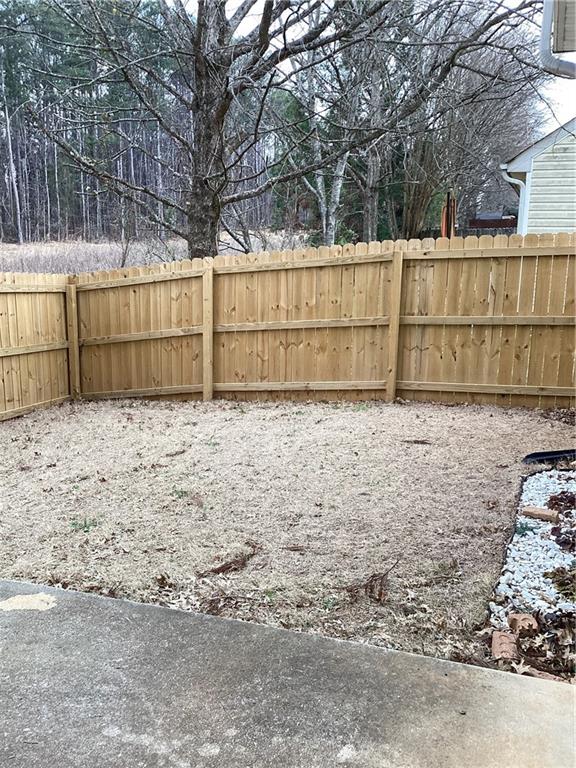 2546 Tullamore Circle Snellville, GA 30039 - Photo 33 of 35 a view of backyard with wooden fence