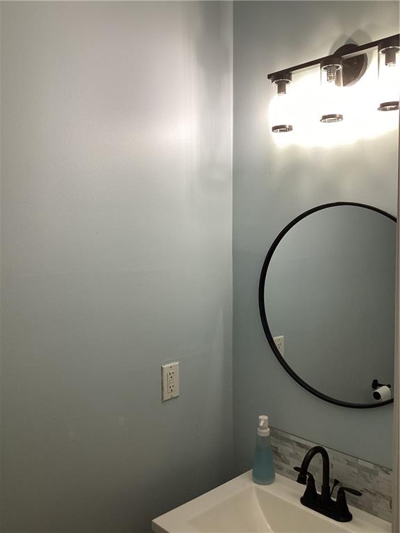 2546 Tullamore Circle Snellville, GA 30039 - Photo 35 of 35 a bathroom with a sink and mirror