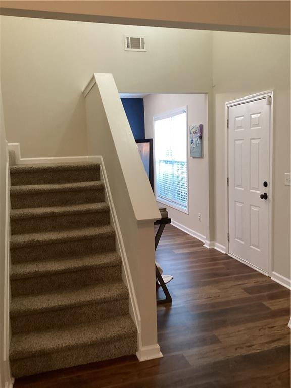 2546 Tullamore Circle Snellville, GA 30039 - Photo 4 of 35 a view of entryway with wooden floor and stairs