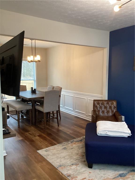 2546 Tullamore Circle Snellville, GA 30039 - Photo 6 of 35 a living room with furniture and a flat screen tv