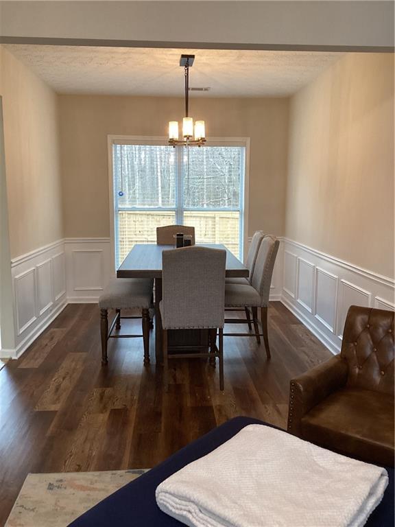 2546 Tullamore Circle Snellville, GA 30039 - Photo 7 of 35 a view of a dining room with furniture window and wooden floor