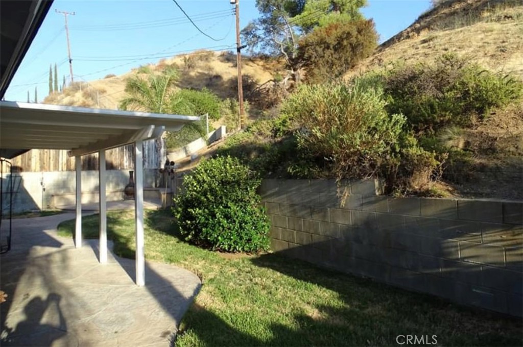 22654 La Rochelle Drive Saugus, CA 91350 - Photo 2 of 13 a view of a yard with plants and a lake view