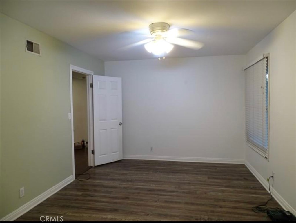 22654 La Rochelle Drive Saugus, CA 91350 - Photo 5 of 13 a view of an empty room with wooden floor and a window