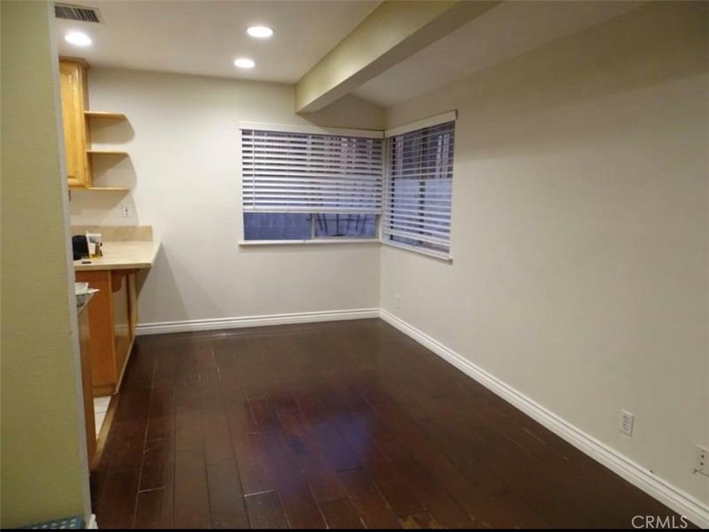 22654 La Rochelle Drive Saugus, CA 91350 - Photo 7 of 13 a view of an empty room with wooden floor and a window