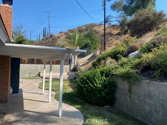 a balcony with lots of green space
