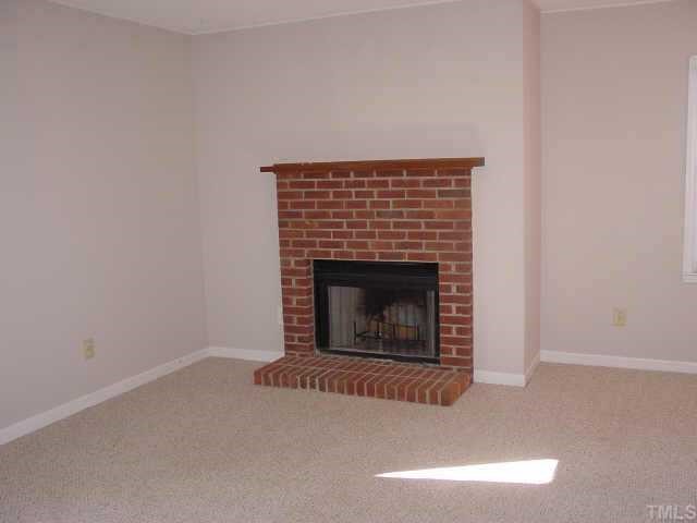 3539 Mill Run Raleigh, NC 27612 - Photo 7 of 10 The Family room includes a real masonry fireplace.
