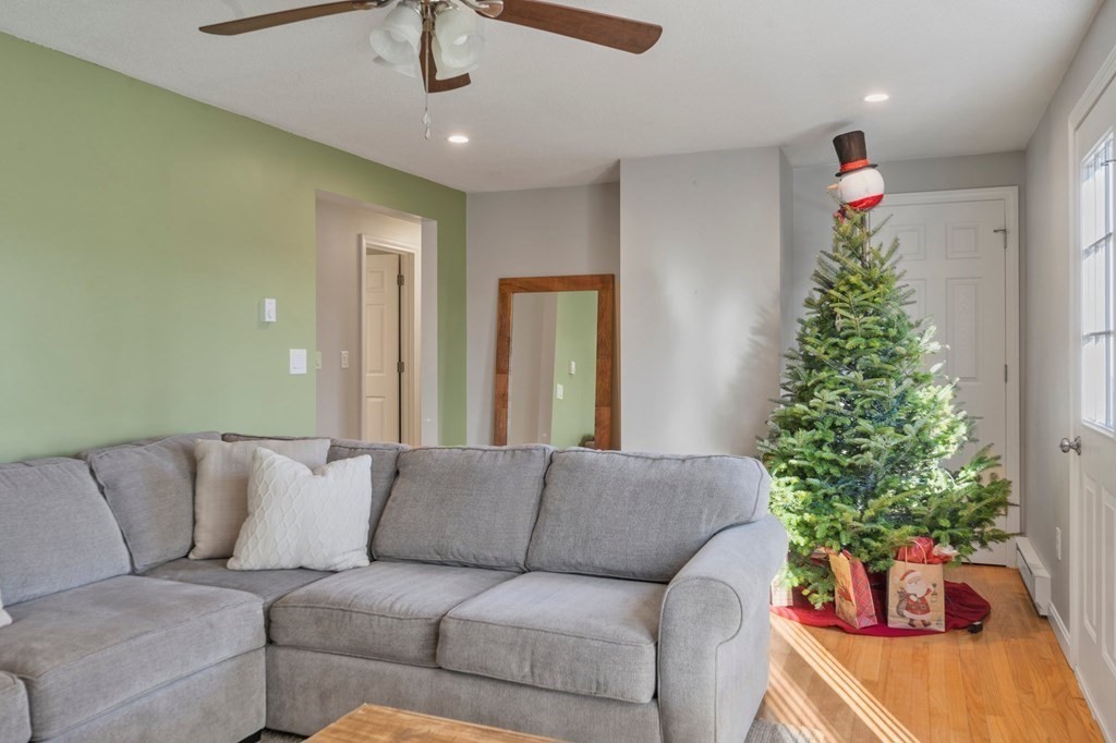 114 Upper Palmer Road Monson, MA 01057 - Photo 11 of 34 a living room with furniture and a potted plant