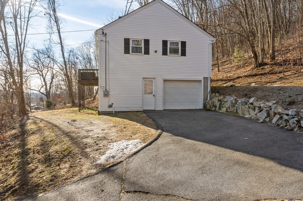 114 Upper Palmer Road Monson, MA 01057 - Photo 4 of 34 a view of a white house with a yard covered with snow