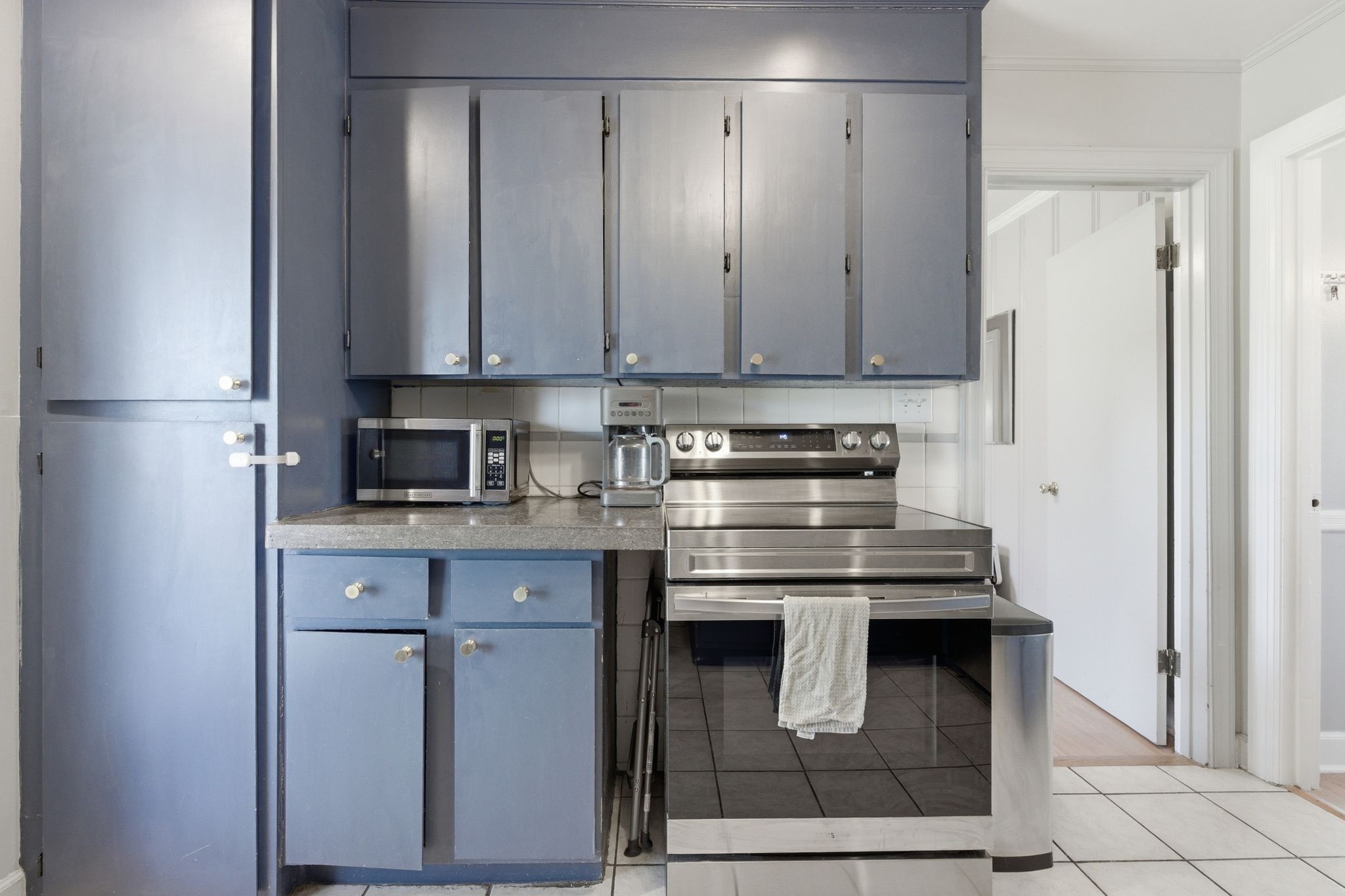 3938 East Ridge Drive Nashville, TN 37211 - Photo 14 of 32 a kitchen with stainless steel appliances granite countertop a stove and a refrigerator