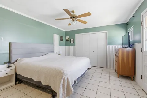 a bedroom with a bed and a fireplace