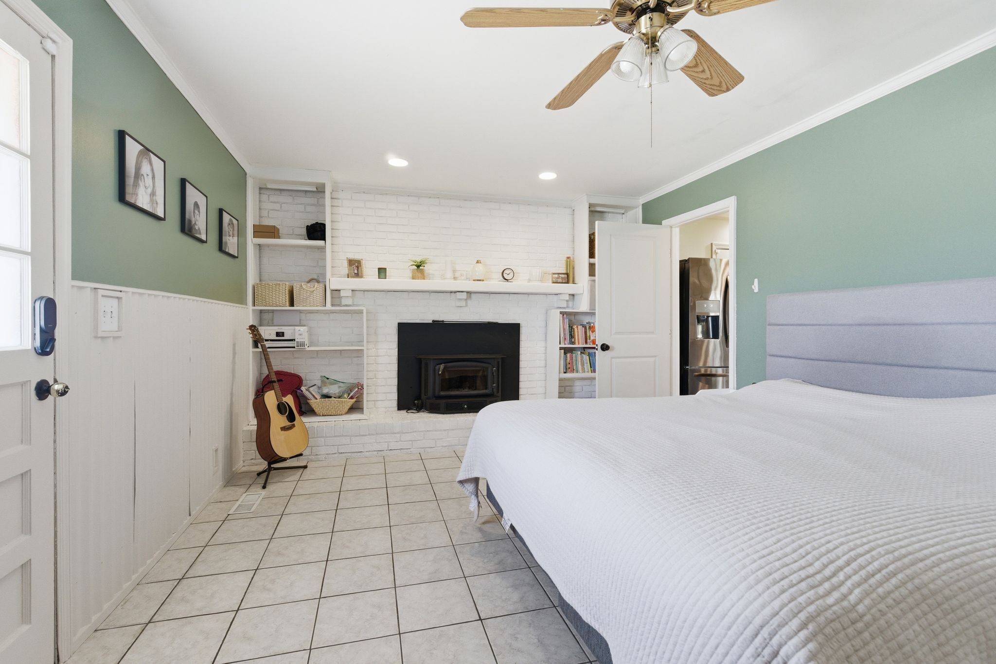 3938 East Ridge Drive Nashville, TN 37211 - Photo 17 of 32 a bedroom with a bed and a fireplace