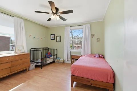 a room with a bed and a mirror