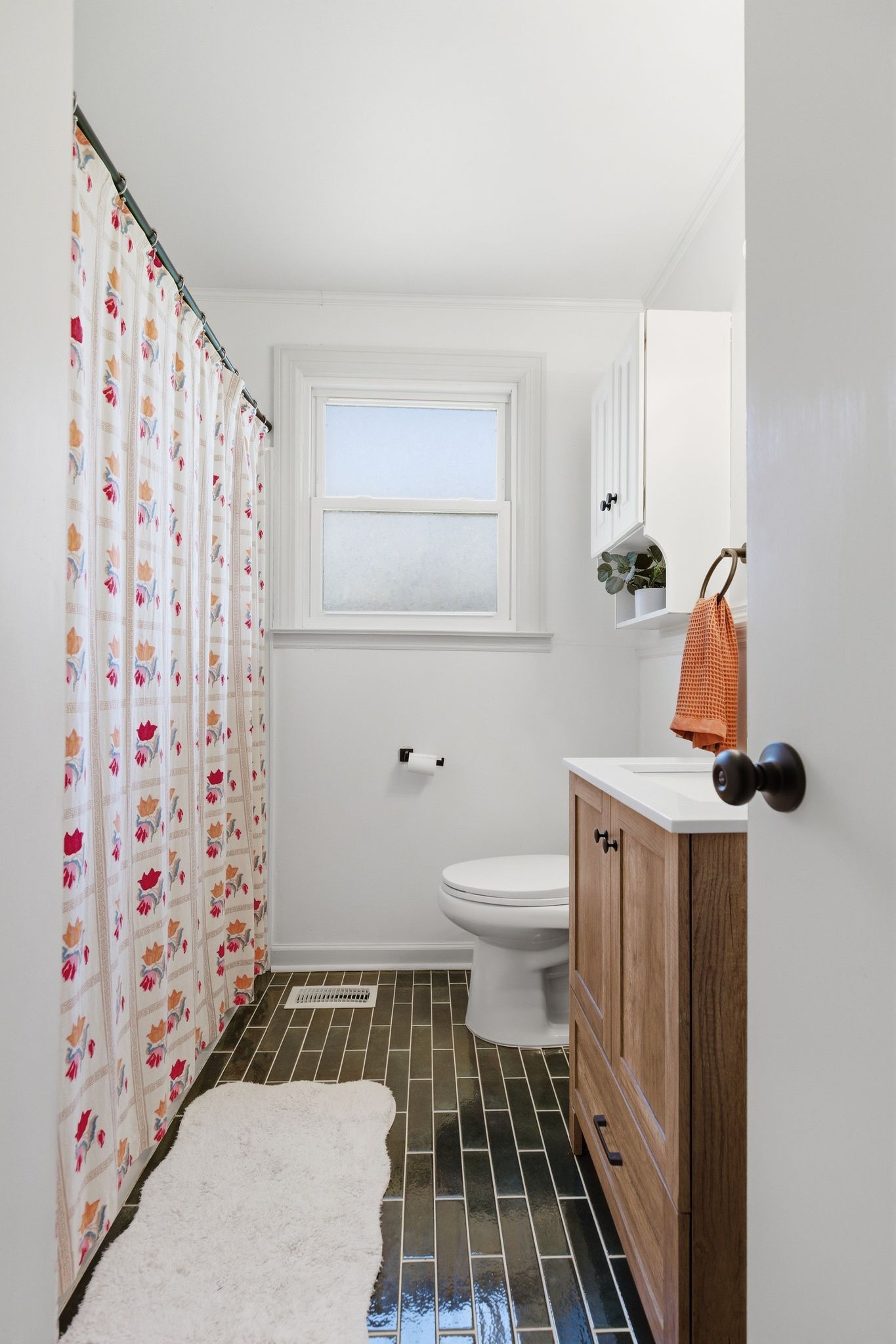 3938 East Ridge Drive Nashville, TN 37211 - Photo 24 of 32 a bathroom with a toilet and a shower curtain