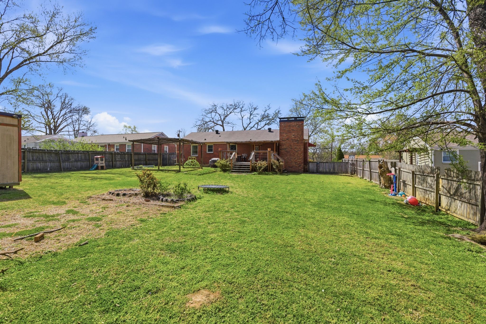 3938 East Ridge Drive Nashville, TN 37211 - Photo 32 of 32 a view of a yard with a house in the background