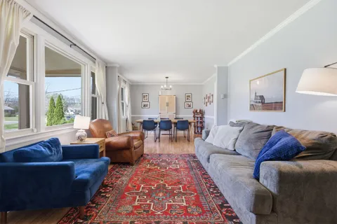 a living room with furniture and a rug