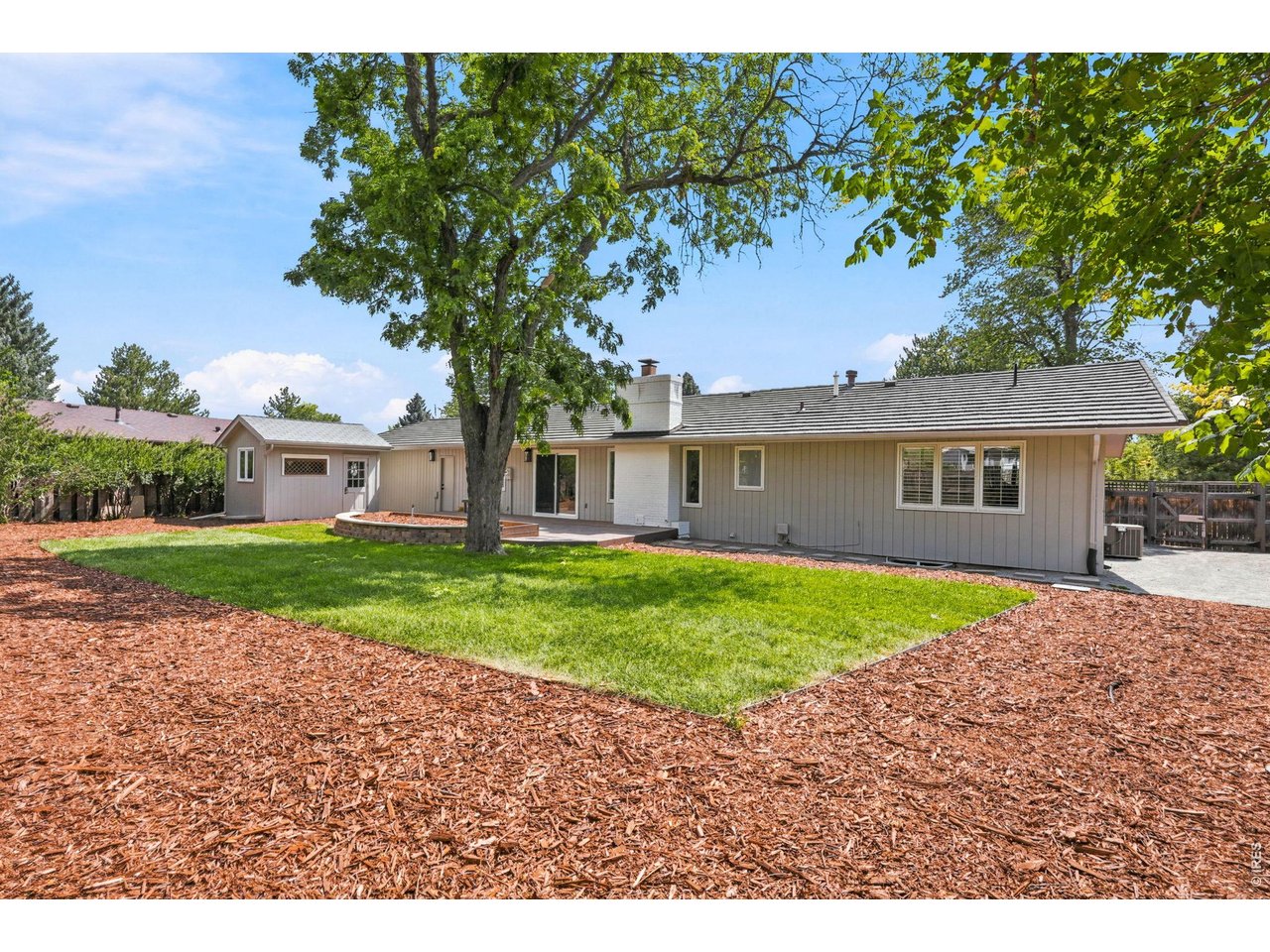 4788 Briar Ridge Trail Boulder, CO 80301 - Photo 41 of 45 Spacious, fully fenced backyard featuring a large deck off the kitchen, new sod, fresh mulch, raised garden bed and a professional-grade sprinkler system.