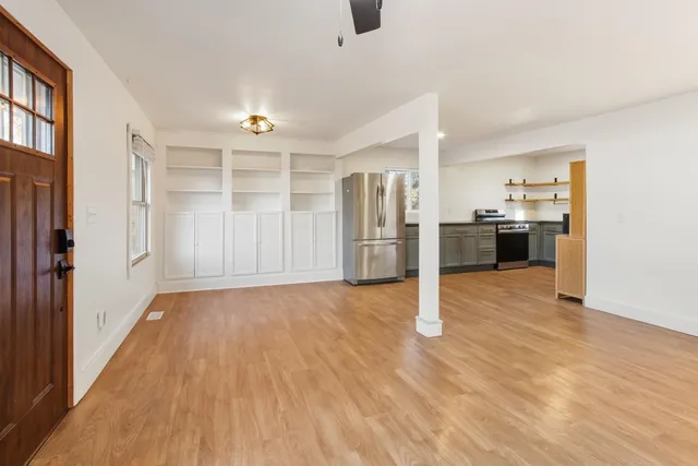 a view of a kitchen with a stove cabinets and wooden floor