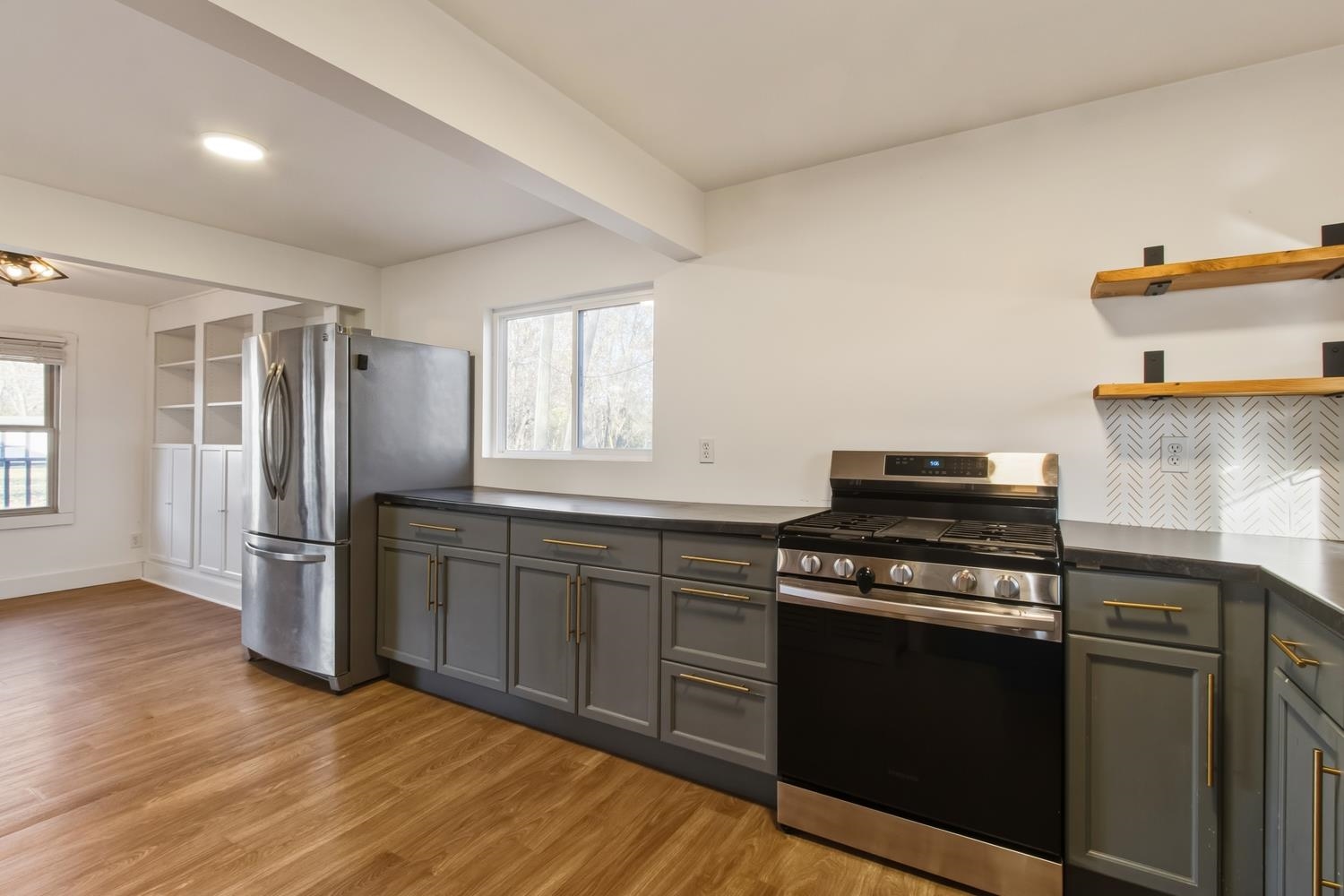 506 Eells Avenue Dixon, IL 61021 - Photo 7 of 19 a kitchen with a stove and a refrigerator