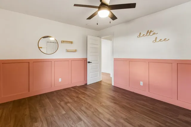 a view of room with wooden floor